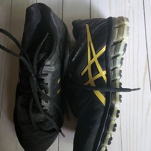 ASICS running shoes. Very little wear. size 6.5 Black and gold